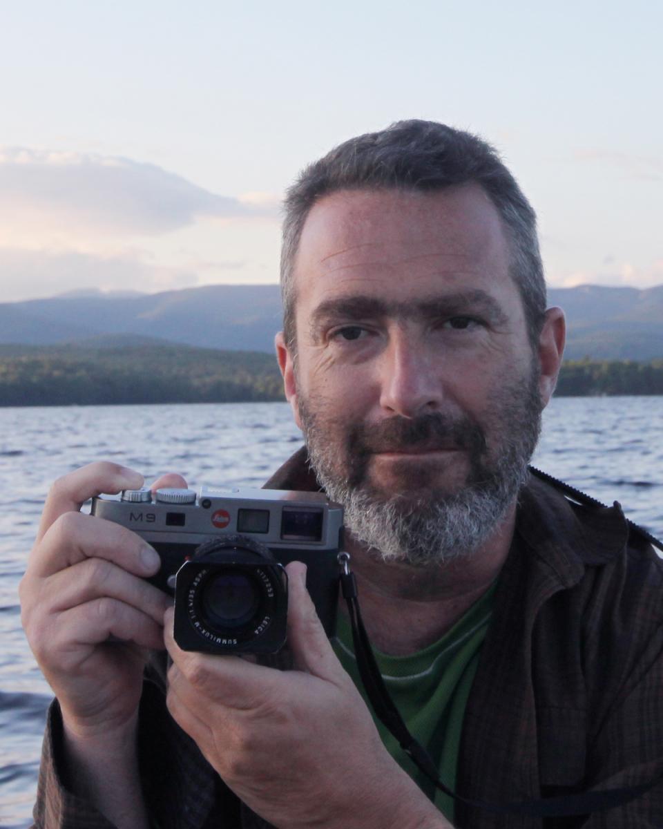 A man holding a camera.