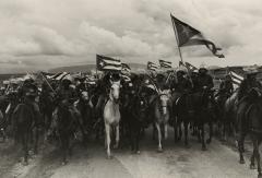 A group of soldier on horses.