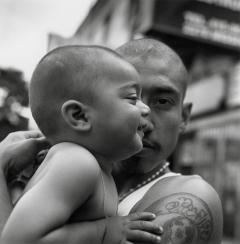 A man holding a baby.