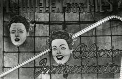 Two faces on a billboard.