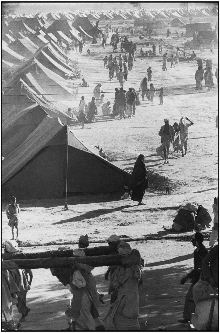 A massive expanse of tents in the middle of the desert.