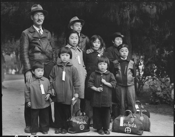 A family photo of a Japanese father and his children.