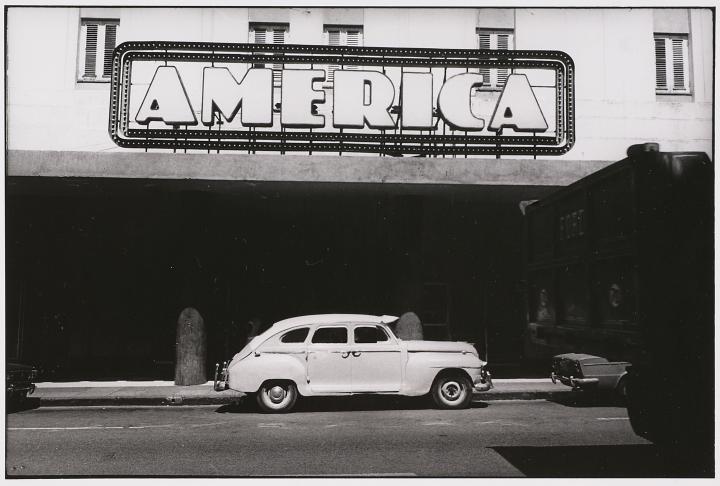 An antique photo of an antique car.