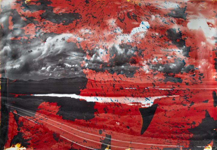 A black and white mountain landscape overlapped with red.