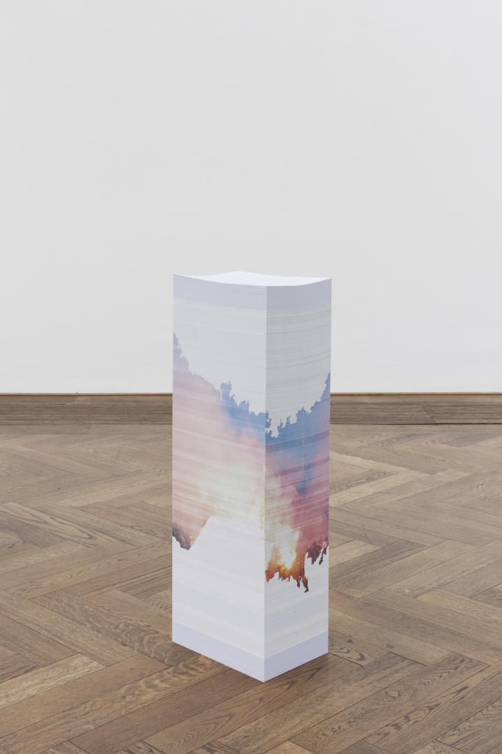 Stack of paper with art drawn around it