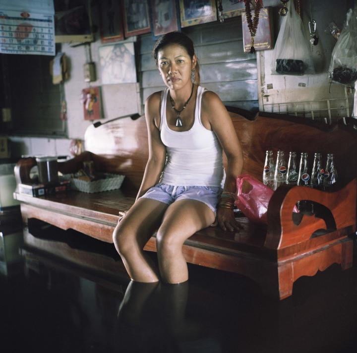 A lady sitting on a bench