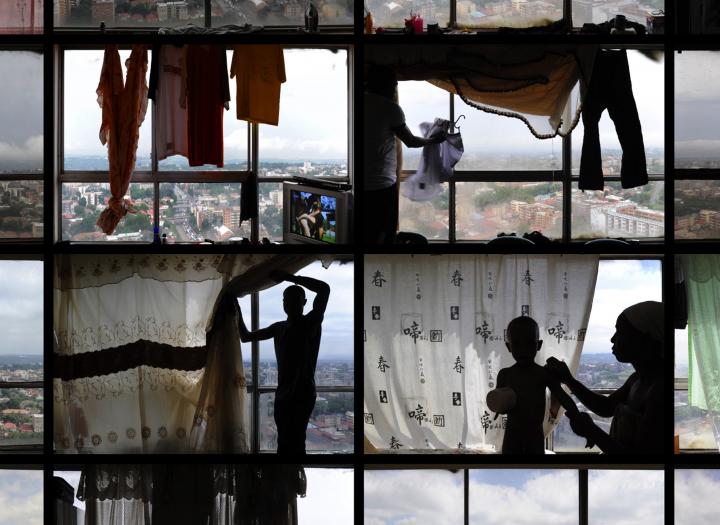 People standing in front of windows